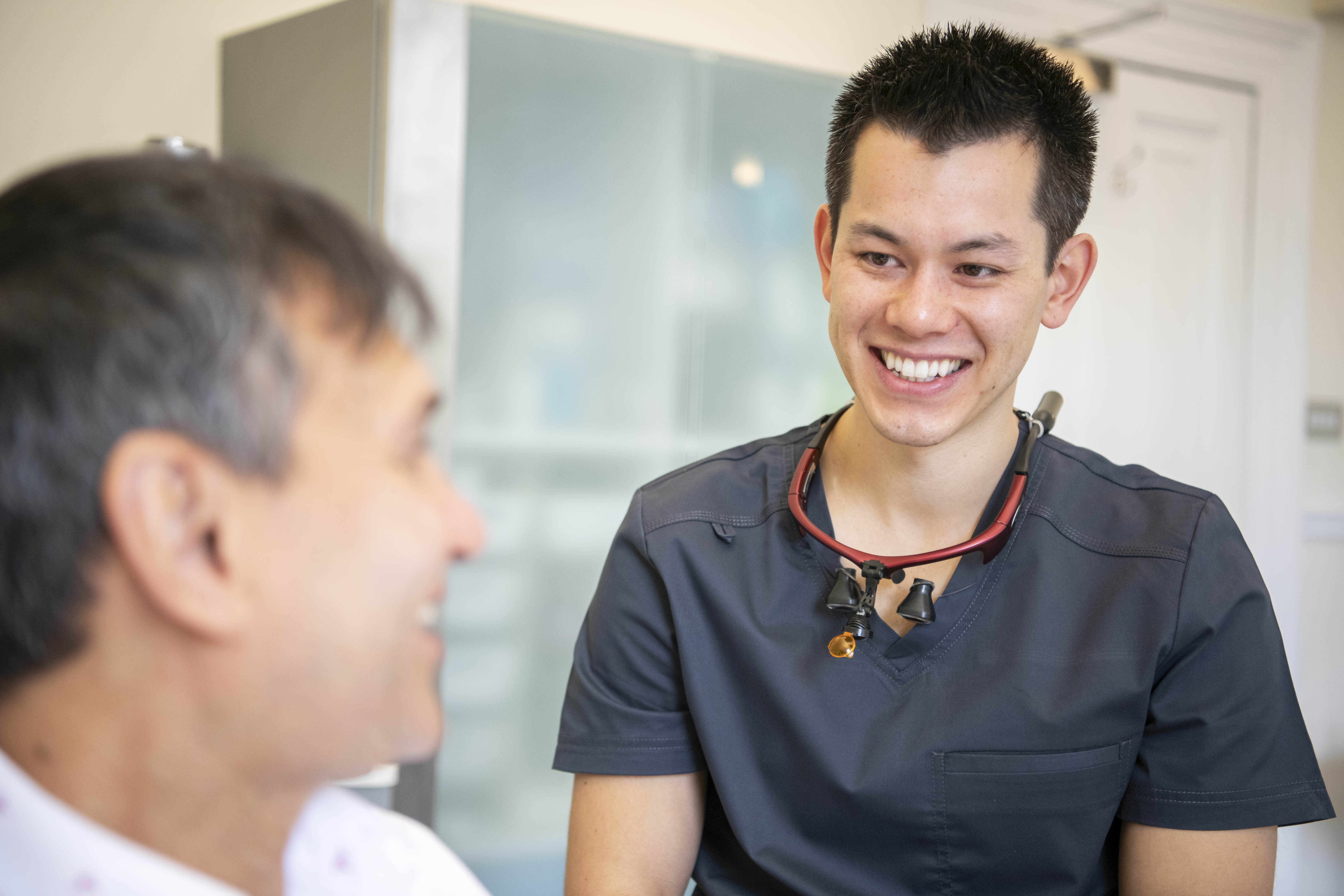 Dentist talking through treatment options with a patient at The Bristol Dental Practice